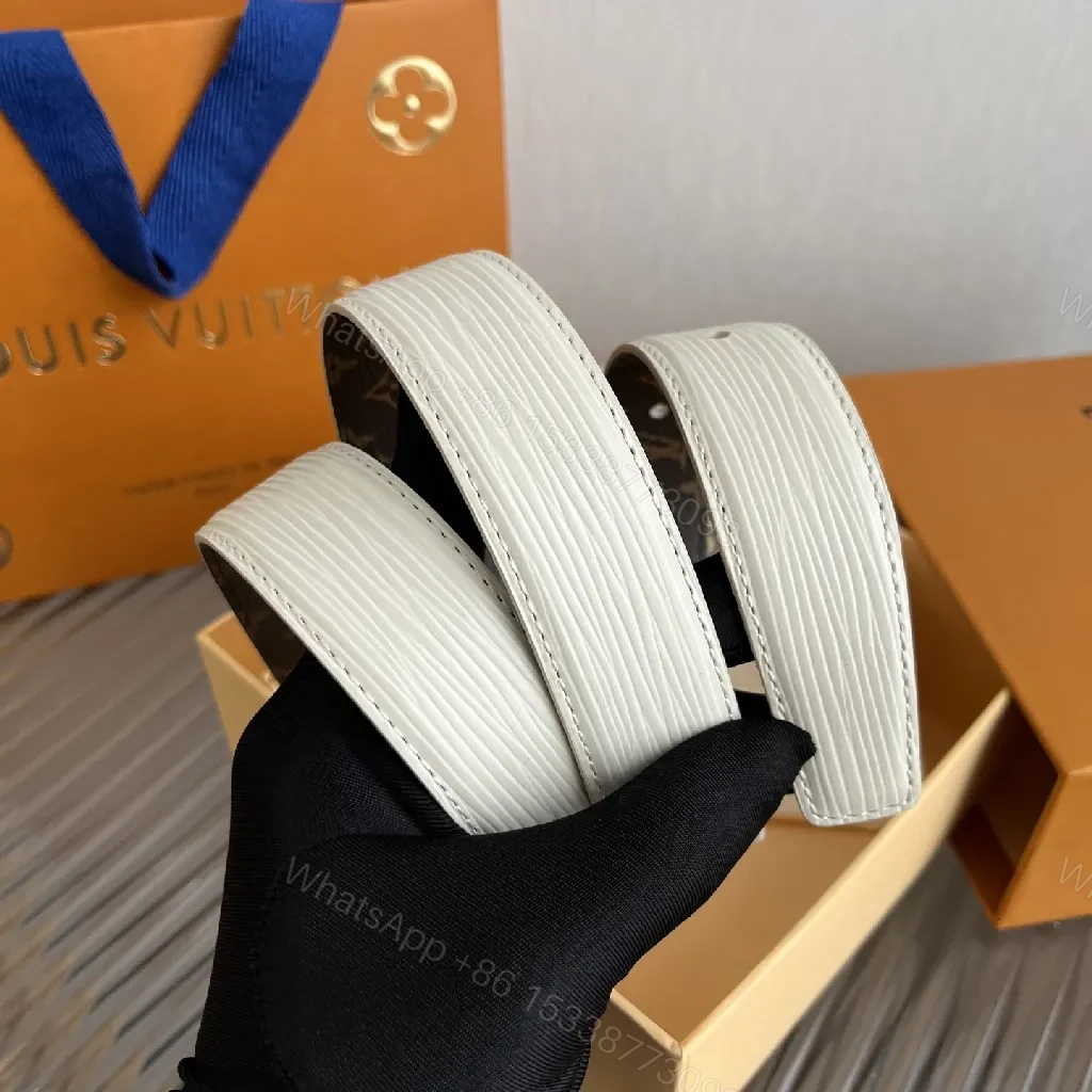 View 5 of White Leather Belt: Subtle Gold Buckle, Monogram Detail, Modern Luxury
