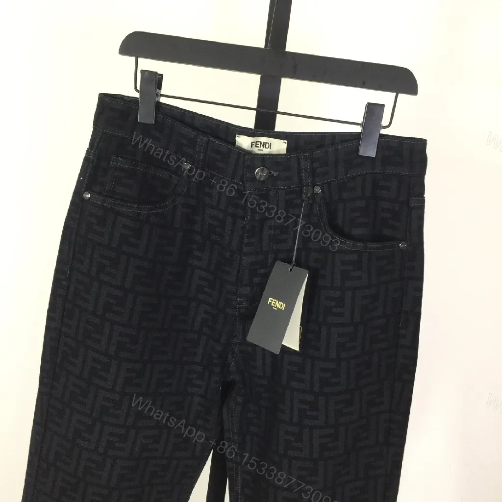 View 3 of Monogram Denim Trousers - Structured Texture, Modern Versatility