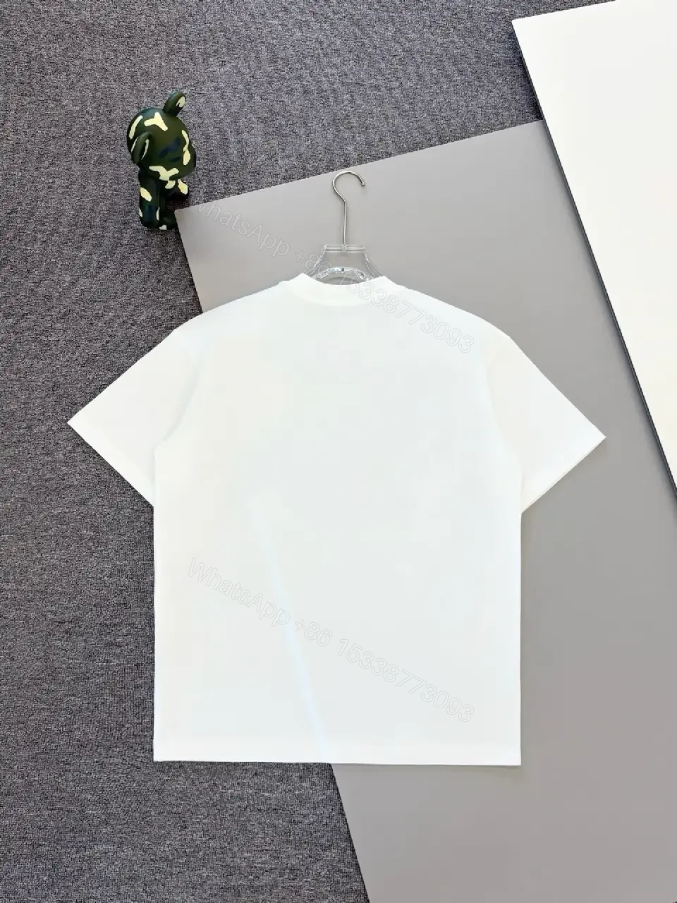 View 8 of Minimal White Tee with Bold Logo Luxury Graphic Tee