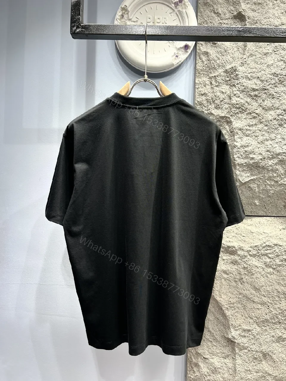 View 4 of Minimalist Black Cotton Tee with Elevated Logo Texture