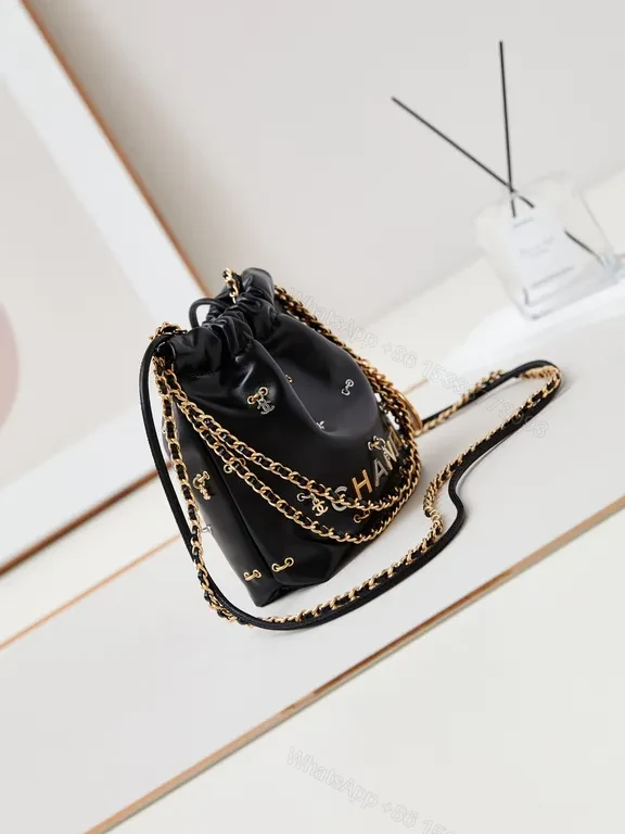 View 3 of Chanel-Inspired Mini Leather Drawstring Bag with Chain Detail