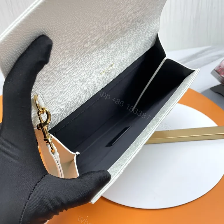 View 8 of Elegant Quilted Envelope Clutch with Gold-YSL Emblem, Ivory, Day-to-Night Essential