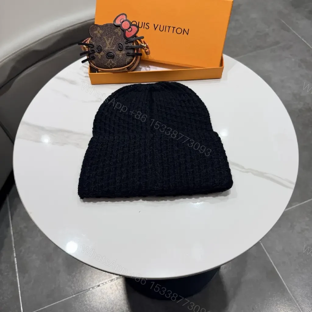 View 4 of Cozy Chic Beanie with Gold LV Emblem — Streetwise Luxury Beanie