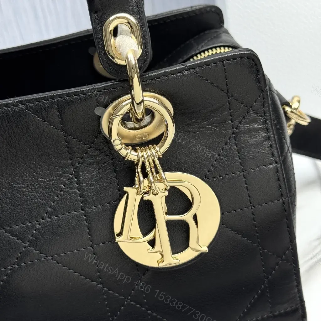 View 9 of Quilted Black Satchel: Gold Charm, Compact Luxury Bag