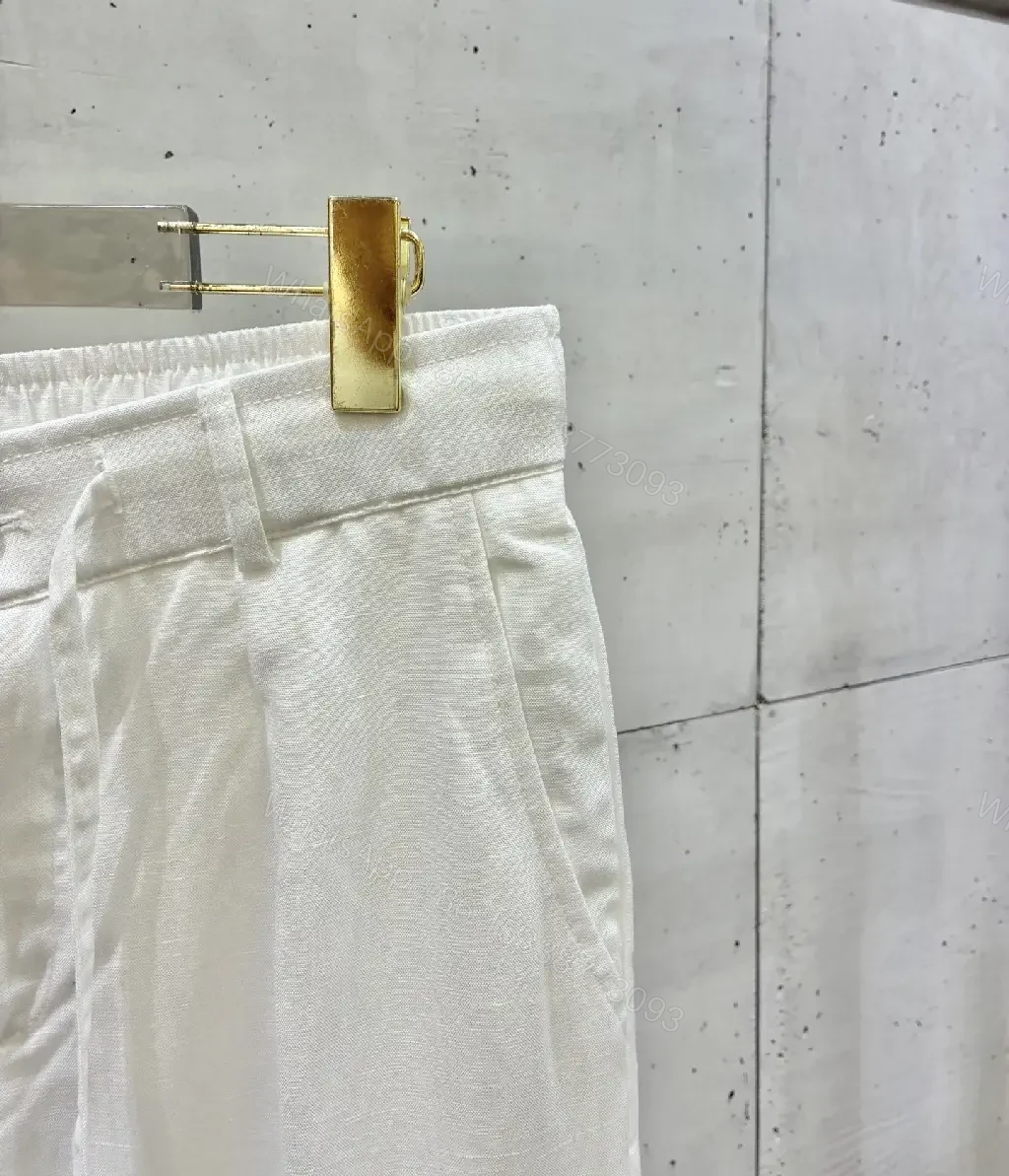 View 3 of Off-White Cream Wide-Leg Trousers with High Waist and Front Fly Closure