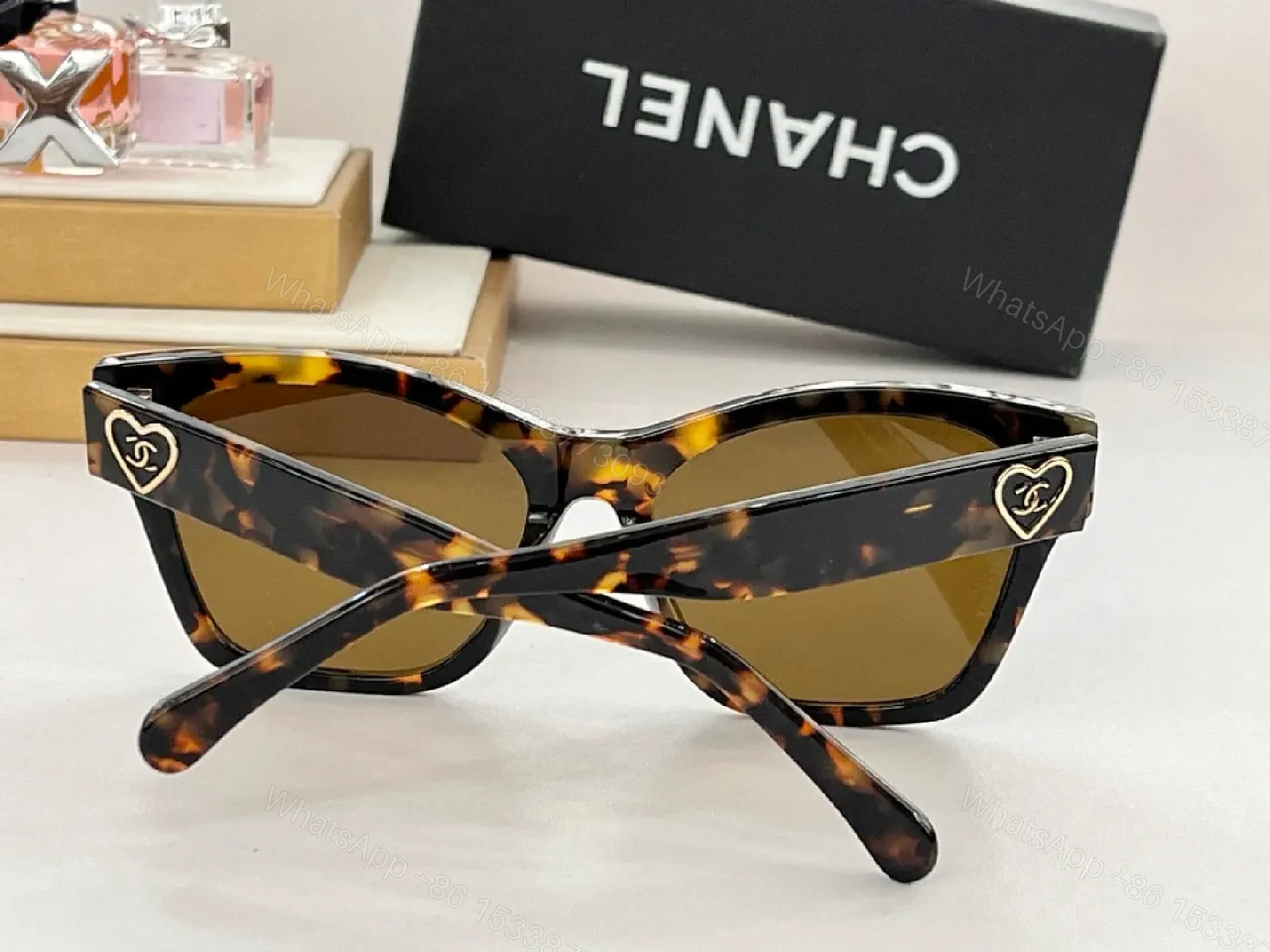 View 7 of Black Cat-Eye Sunglasses with Gold Heart Detail - Premium Acetate