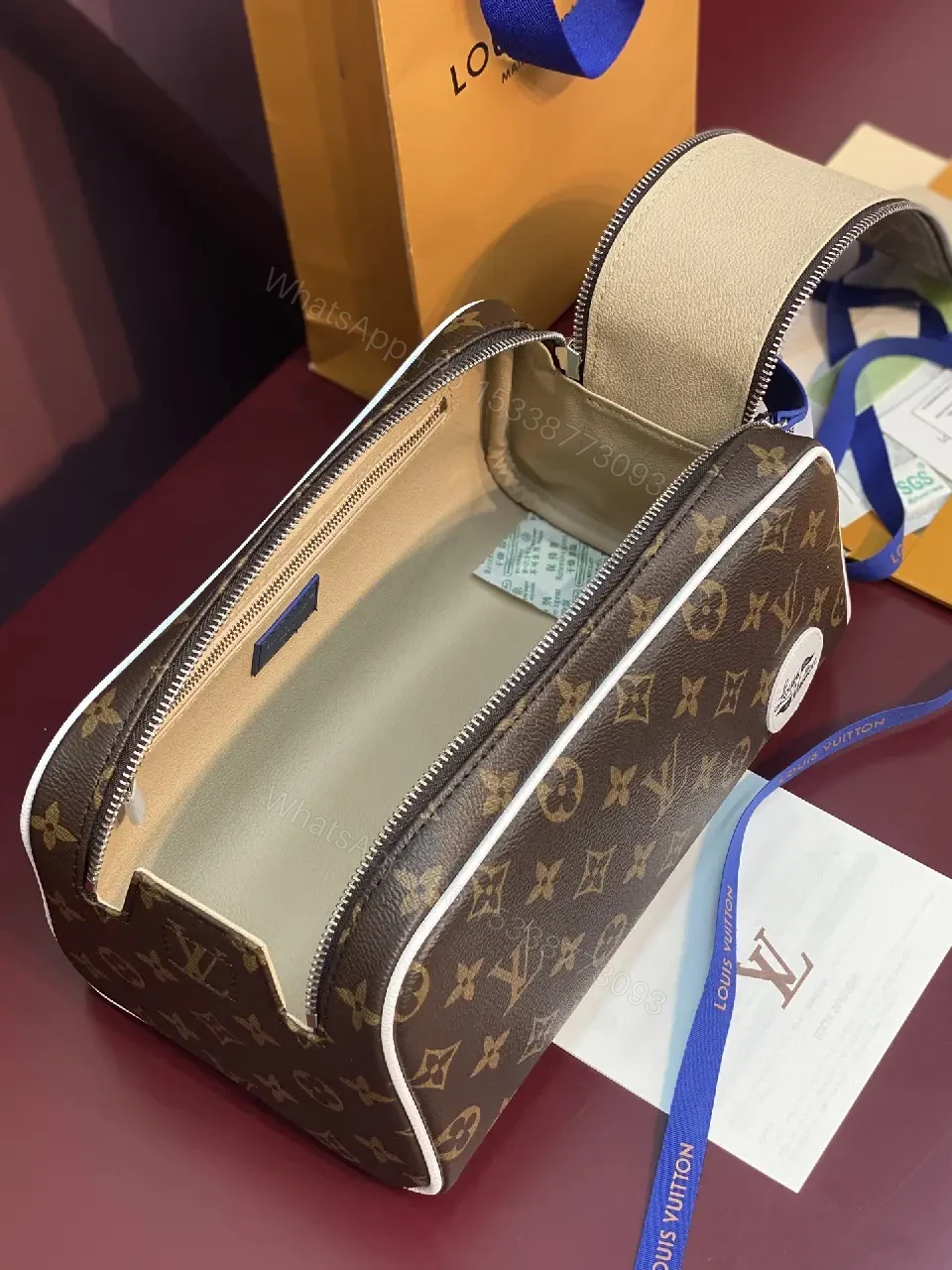 View 7 of Blue Leather Trim Toiletry Bag: Monogram Canvas, LV Zippers, Adjustable Strap