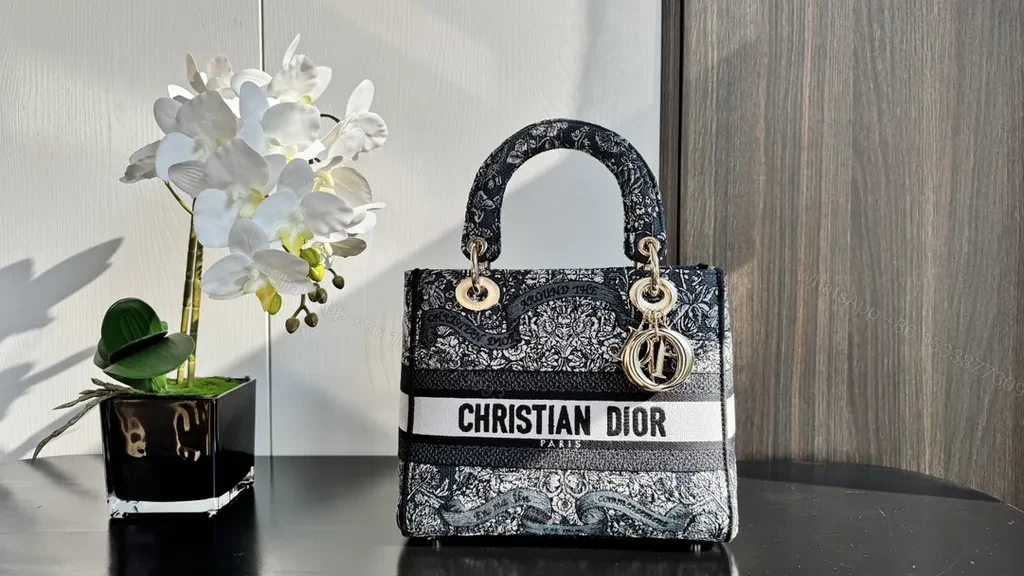 View 2 of Dior Compact Satchel: Textured Luxury with Bold Branding