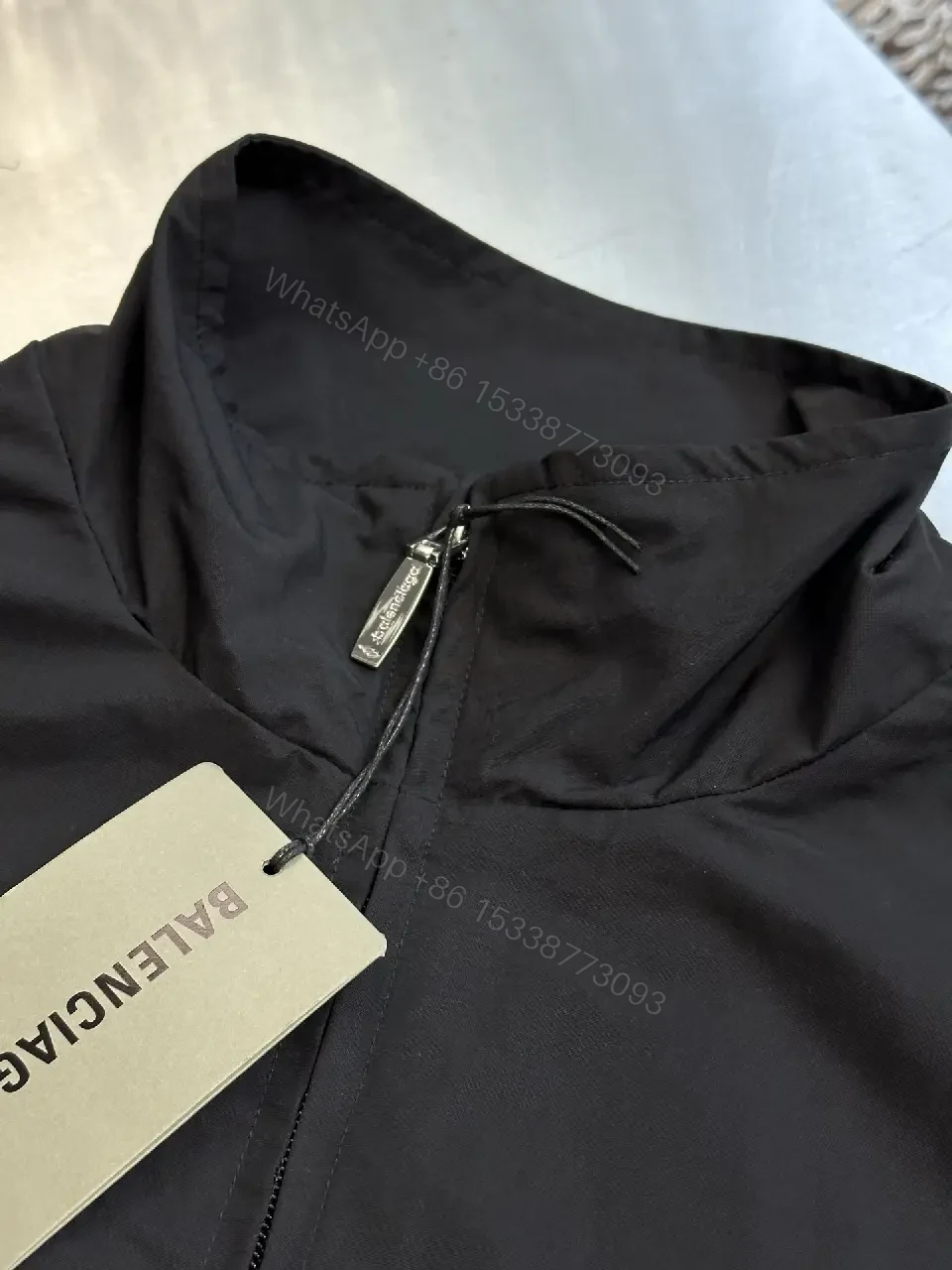 View 6 of Black Nylon Windbreaker Modern Logo-Driven Streetwear Jacket