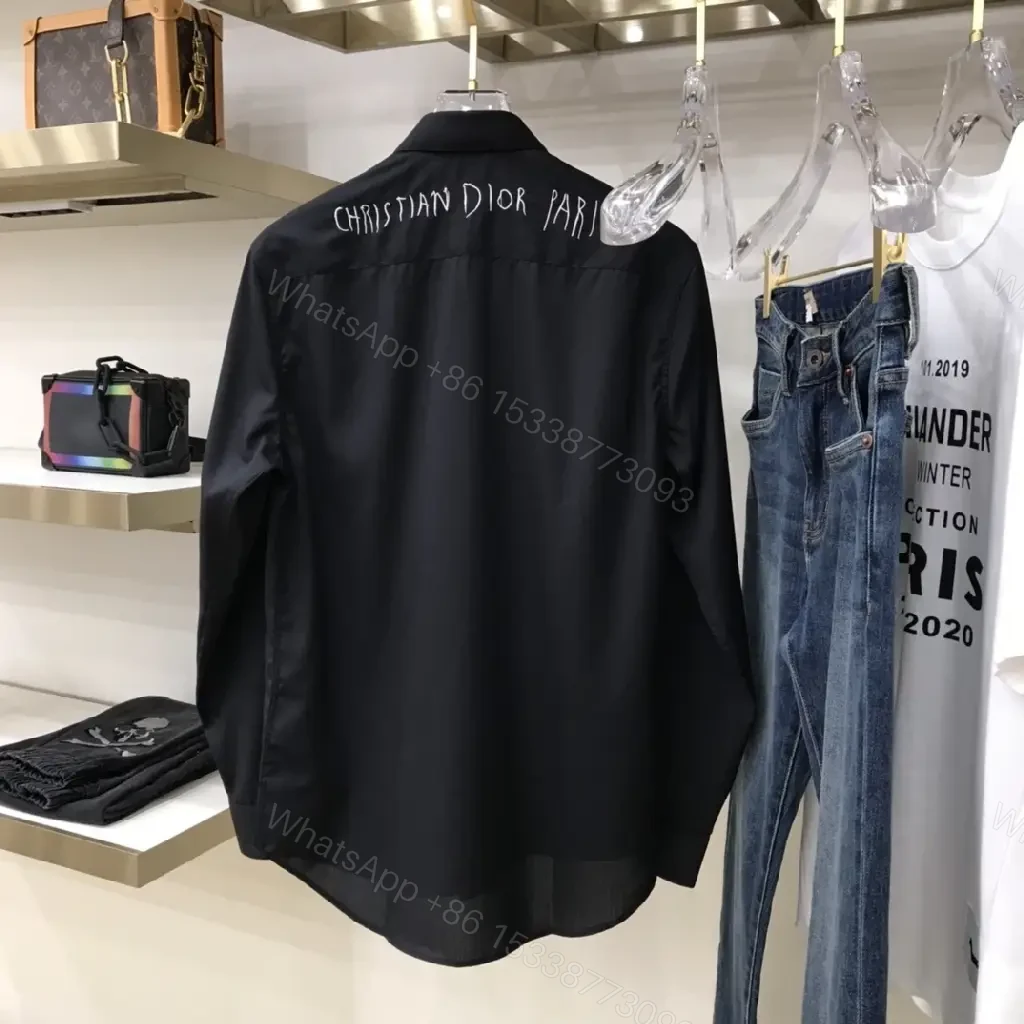 View 3 of Minimal Black Shirt Jacket with Subtle Logo Button Front