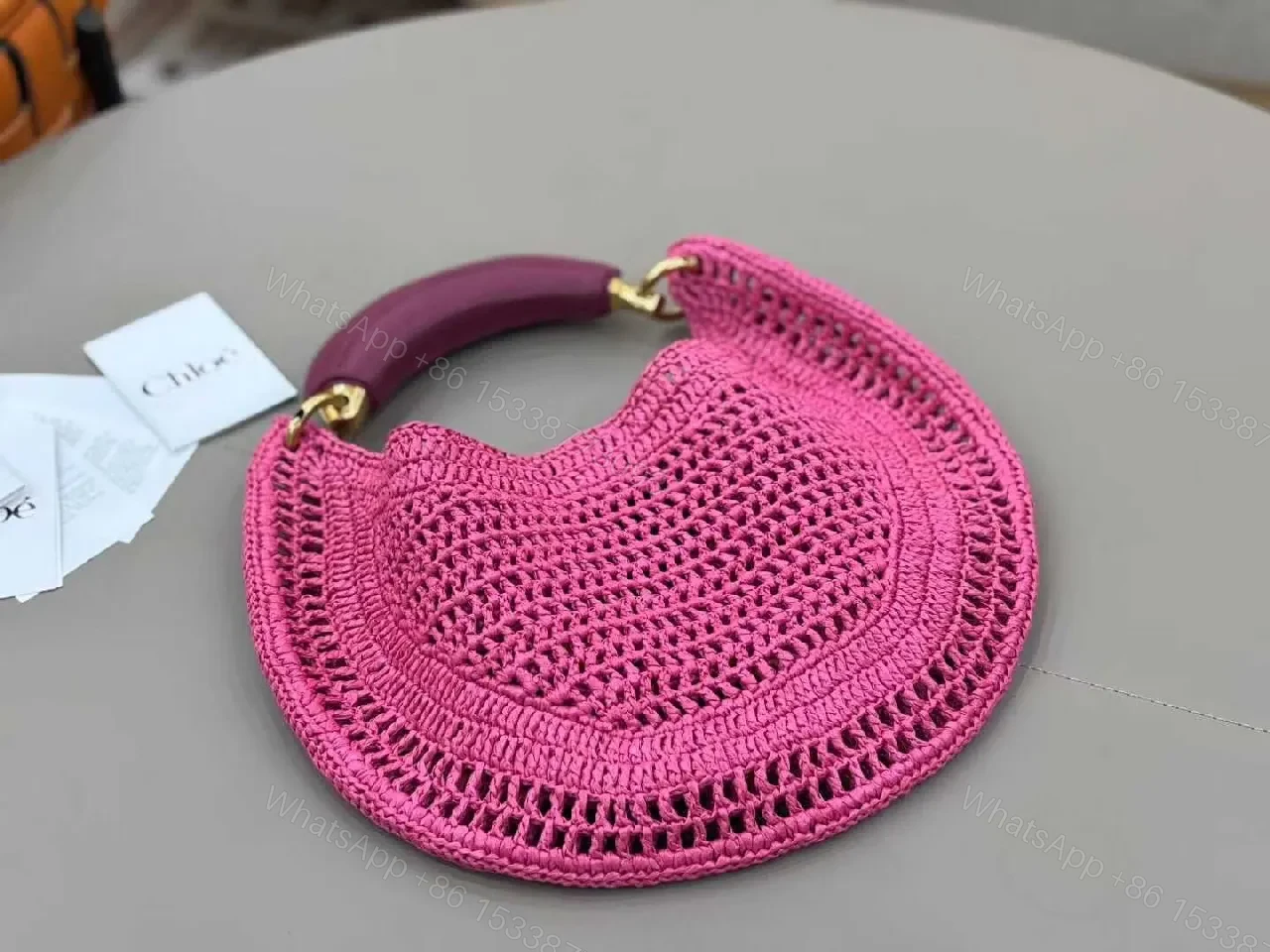 View 3 of Magenta Crochet Crescent Bag: Elegant, Compact, Textured Luxe