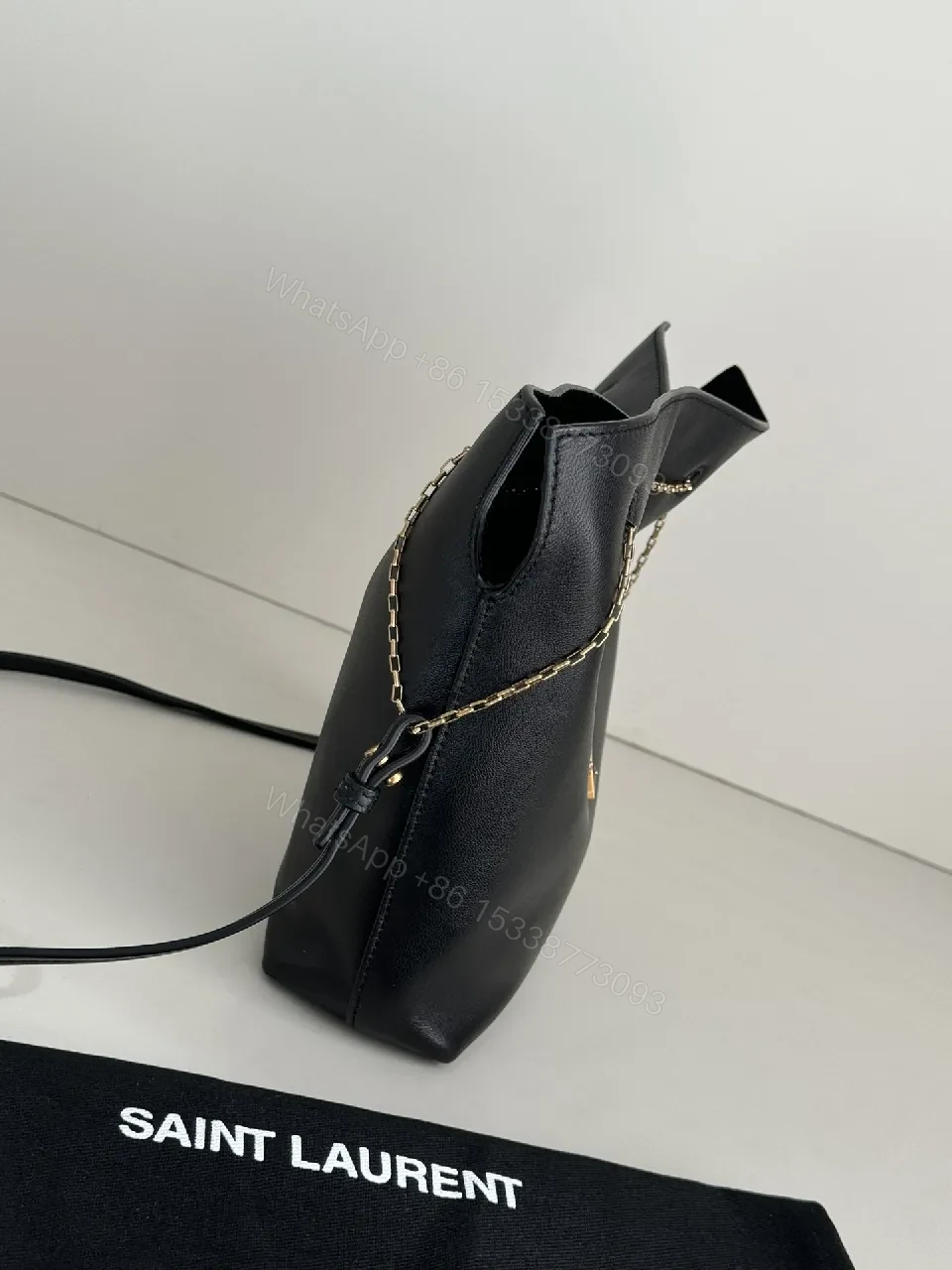 View 9 of Chic Black Leather Bucket Bag with Gold Logo