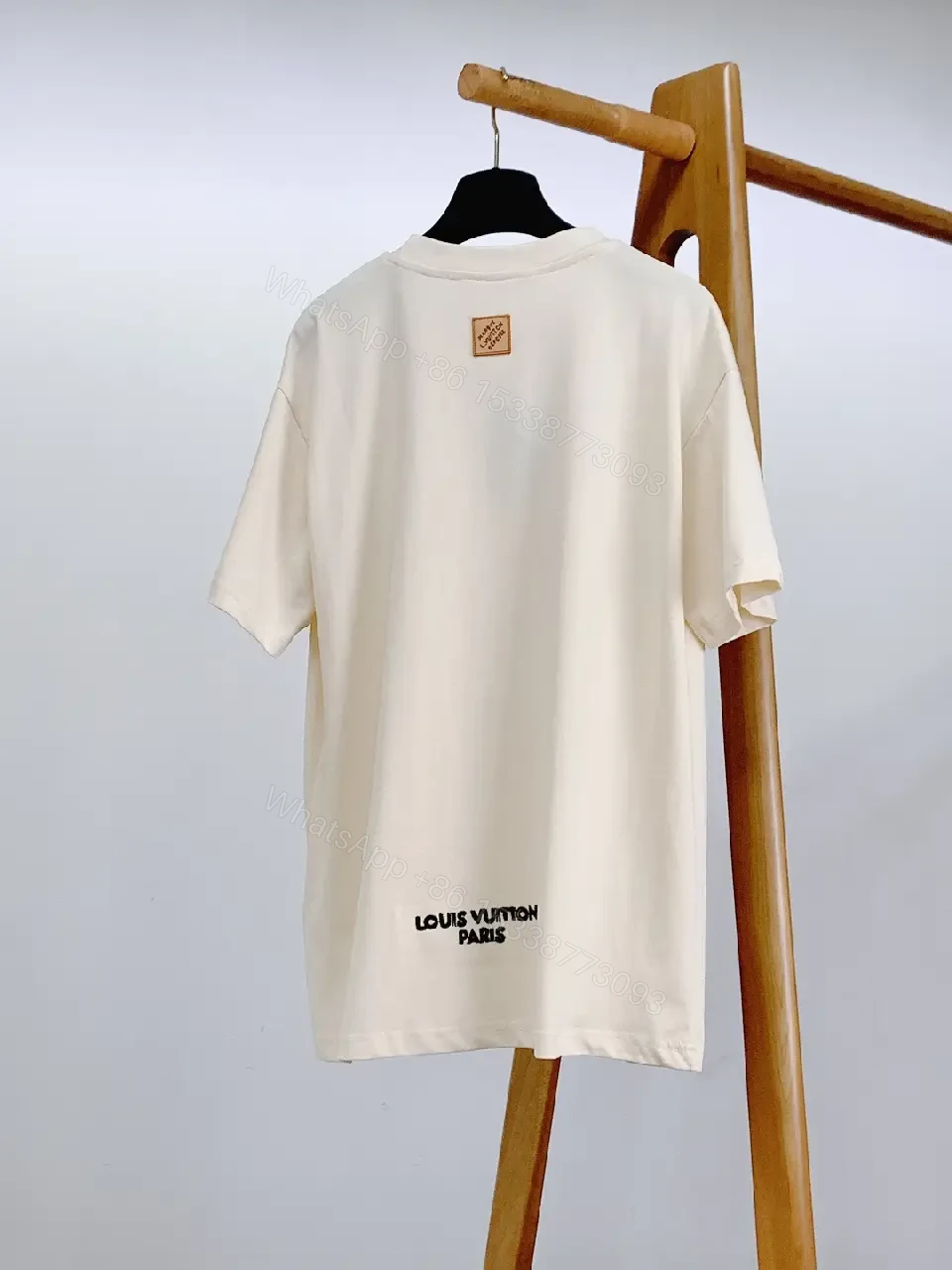View 9 of Minimalist Off-White Cotton Tee with Signature L.V.M. Accent