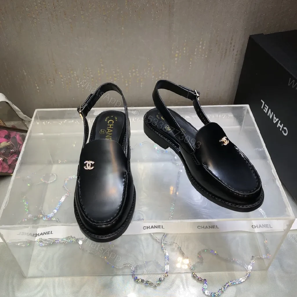 View 2 of Black Leather Mules with Gold Logo Hardware, Minimal Slider Mule