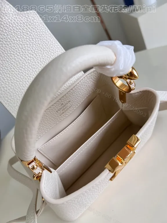 View 4 of Pristine White Pebbled Mini Bag with LV Hardware