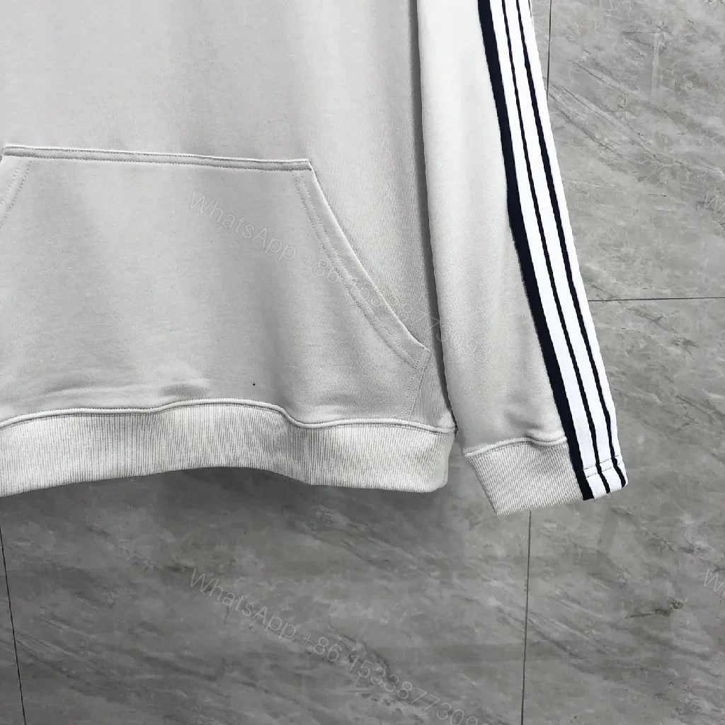 View 3 of Minimalist Sporty Hoodie with Striped Details in Knit Comfort