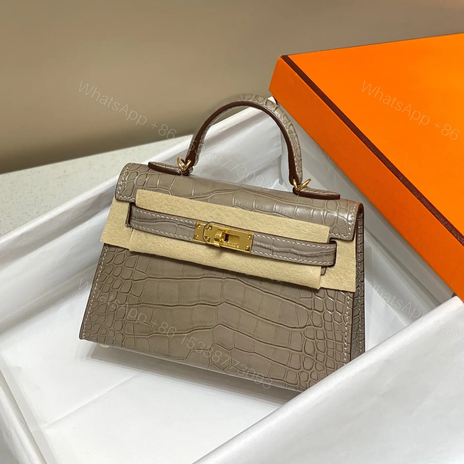 HN MINI KELLY IN MOCHA BROWN CROCODILE SKIN GOLD HARDWARE — view 1