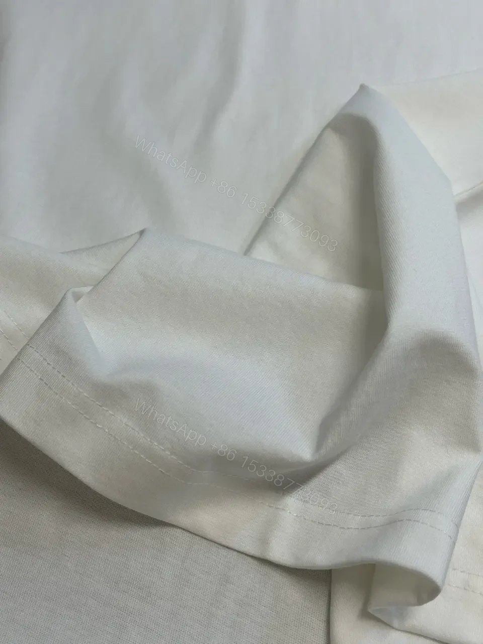 View 3 of Minimalist Burberry-Style White Cotton Tee: Elevated Everyday Comfort