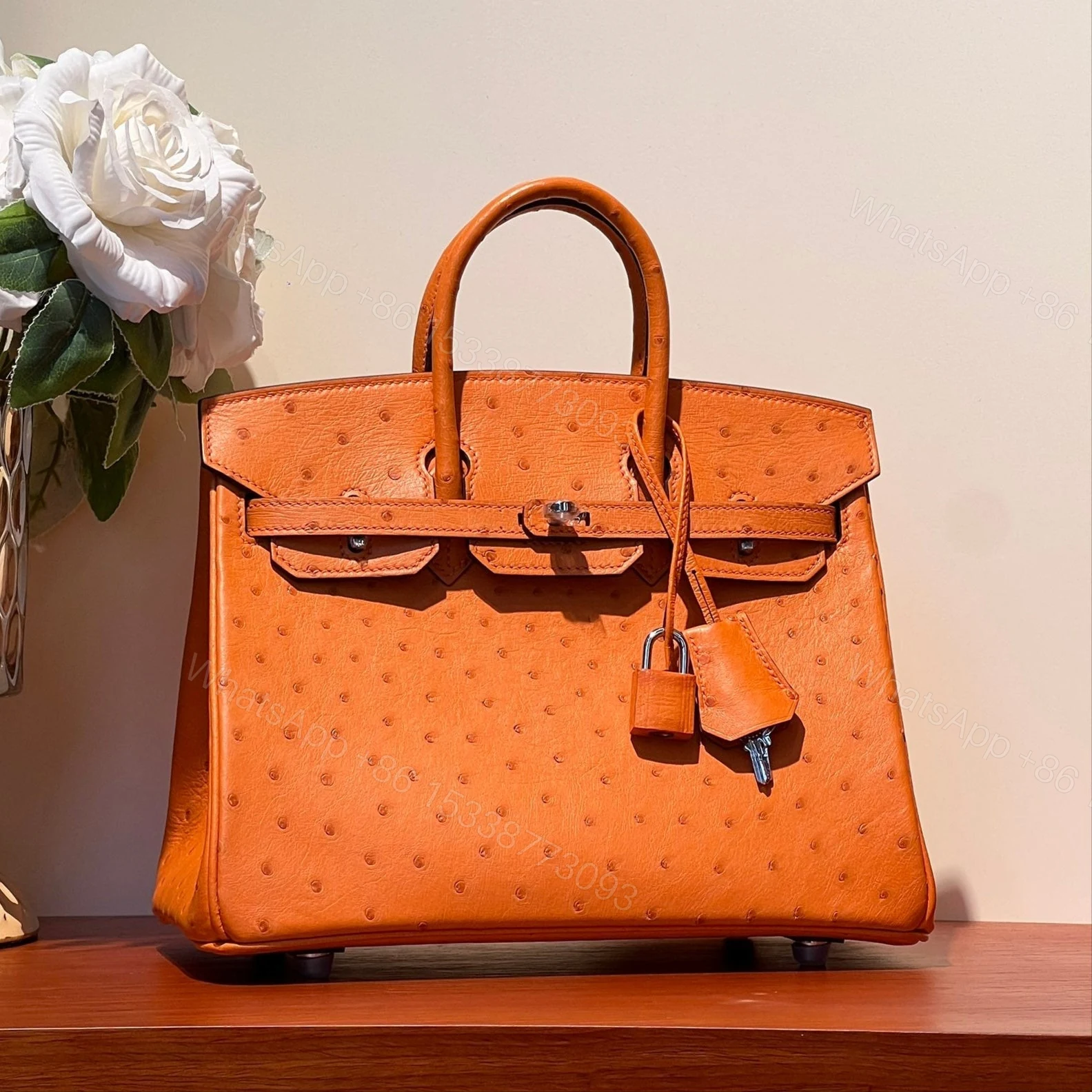HERMES BIRKIN 25 BAG IN FIRE ORANGE OSTRICH LEATHER WITH SILVER HARDWARE — view 1