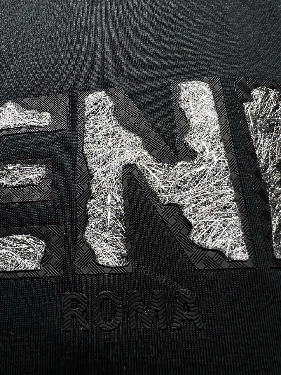 View 5 of Minimalist Black Cotton Tee with Elevated Logo Texture
