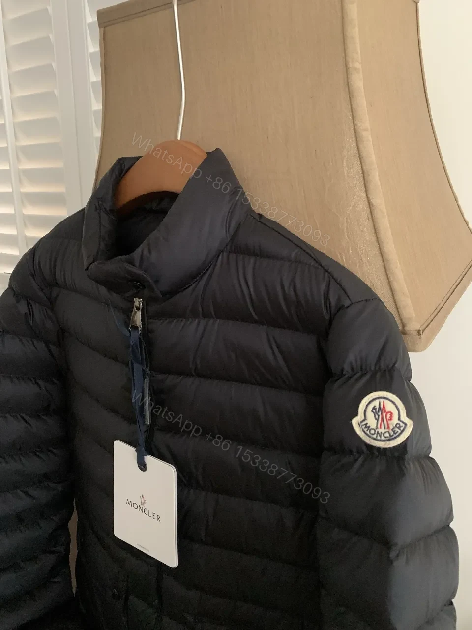 View 2 of Black Nylon Puffer Jacket: Sleek, Insulated Warmth with Patch