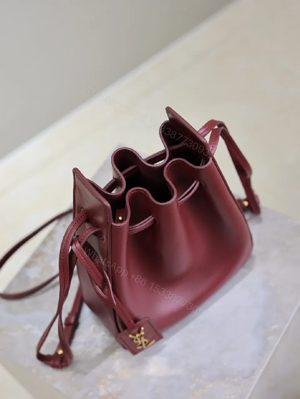 View 8 of Deep Bordeaux Leather Drawstring Bucket Bag—Elevated Everyday Style