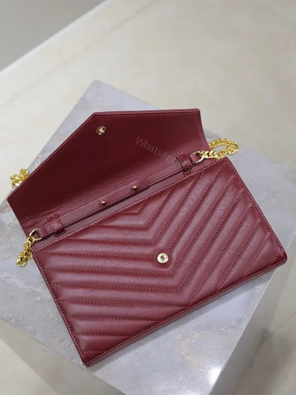 View 5 of Burgundy Quilted Envelope Crossbody Bag with Gold YSL Logo