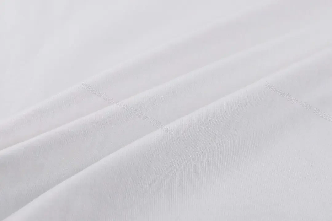 View 2 of Minimalist White Tee with Subtle Burberry Collar Detail