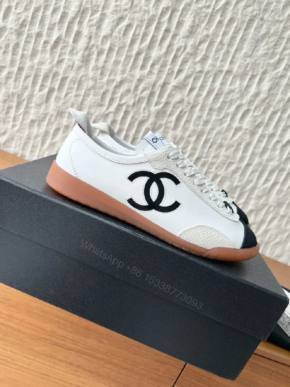 View 9 of Chic Monochrome Leather-Accent Luxury Sneaker, Low-Top