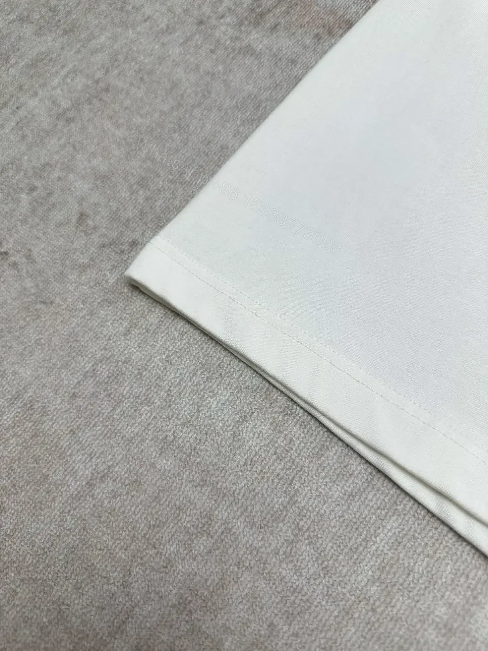 View 7 of Minimalist White Cotton Tee with Embossed Accent, Everyday Luxury
