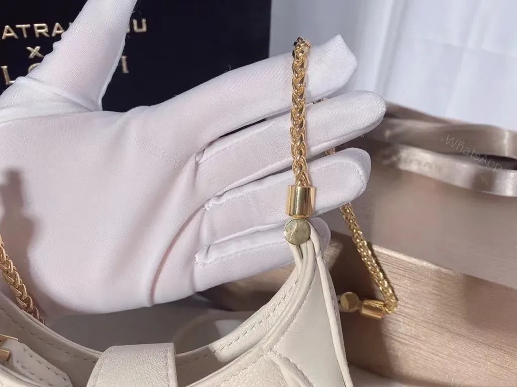 View 2 of Ivory Crescent Mini Bag â€” Day-to-Night Luxury, Sculpted Leather Bag