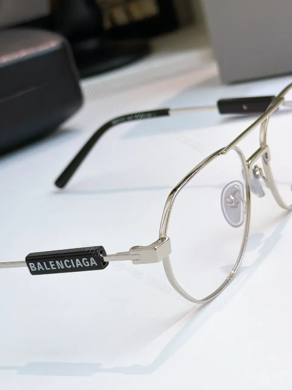 View 8 of Silver Metal Aviator Sunglasses: Luxe Slim Frames with Logo Detailing