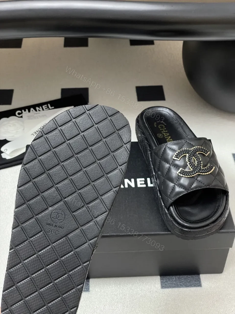 View 6 of Quilted Black Slip-Ons with Gold Emblem – Luxe Style