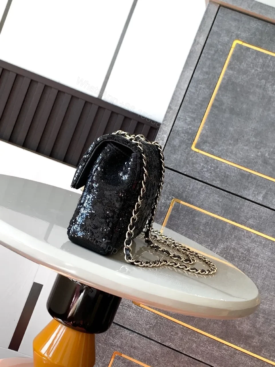 View 2 of Compact Black Sequin Handbag with Chain Strap