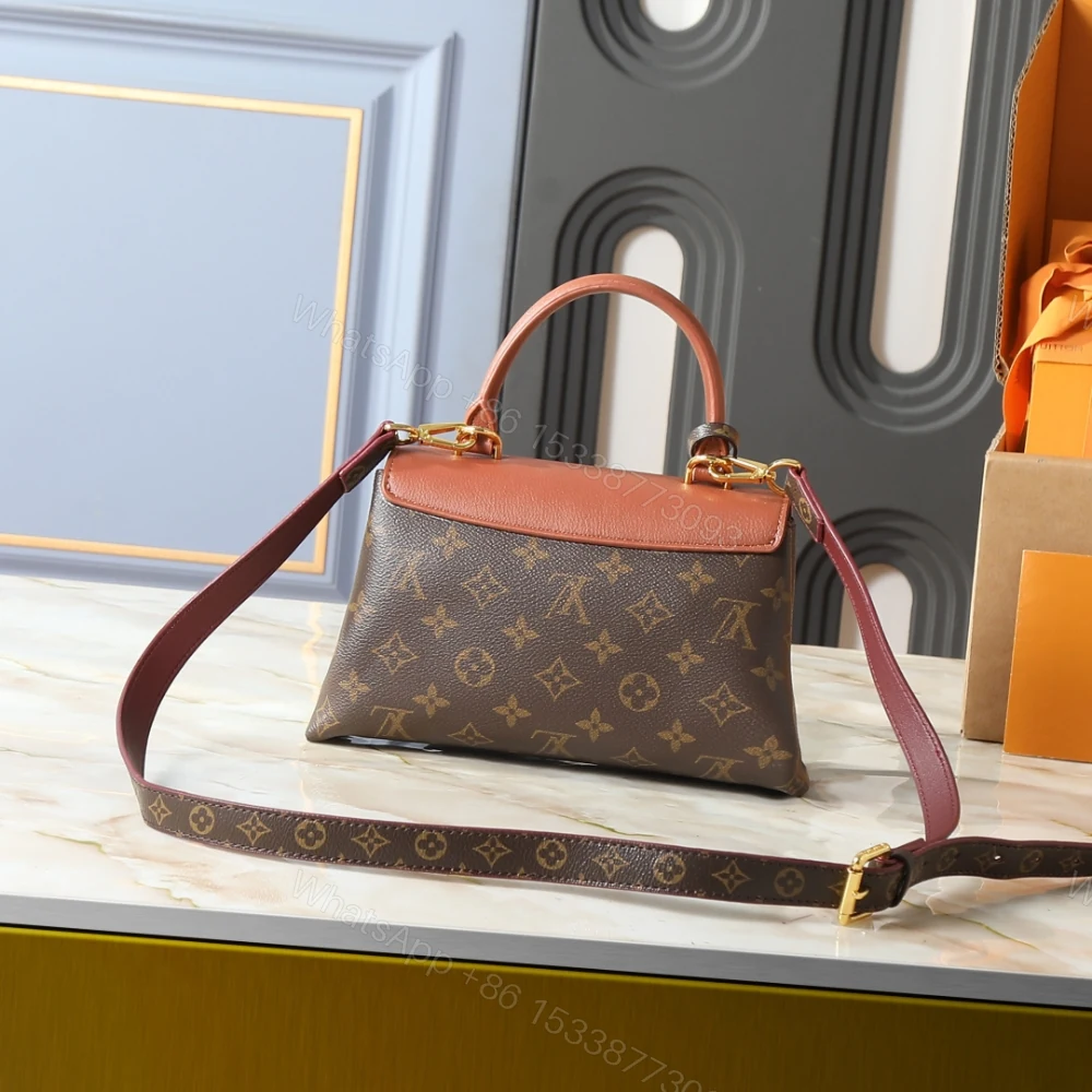 View 4 of Louis Vuitton Madeleine BB Monogram Cognac 24Cm M28288