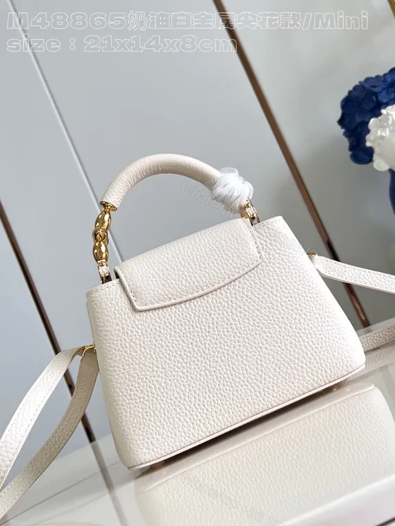 View 2 of Pristine White Pebbled Mini Bag with LV Hardware