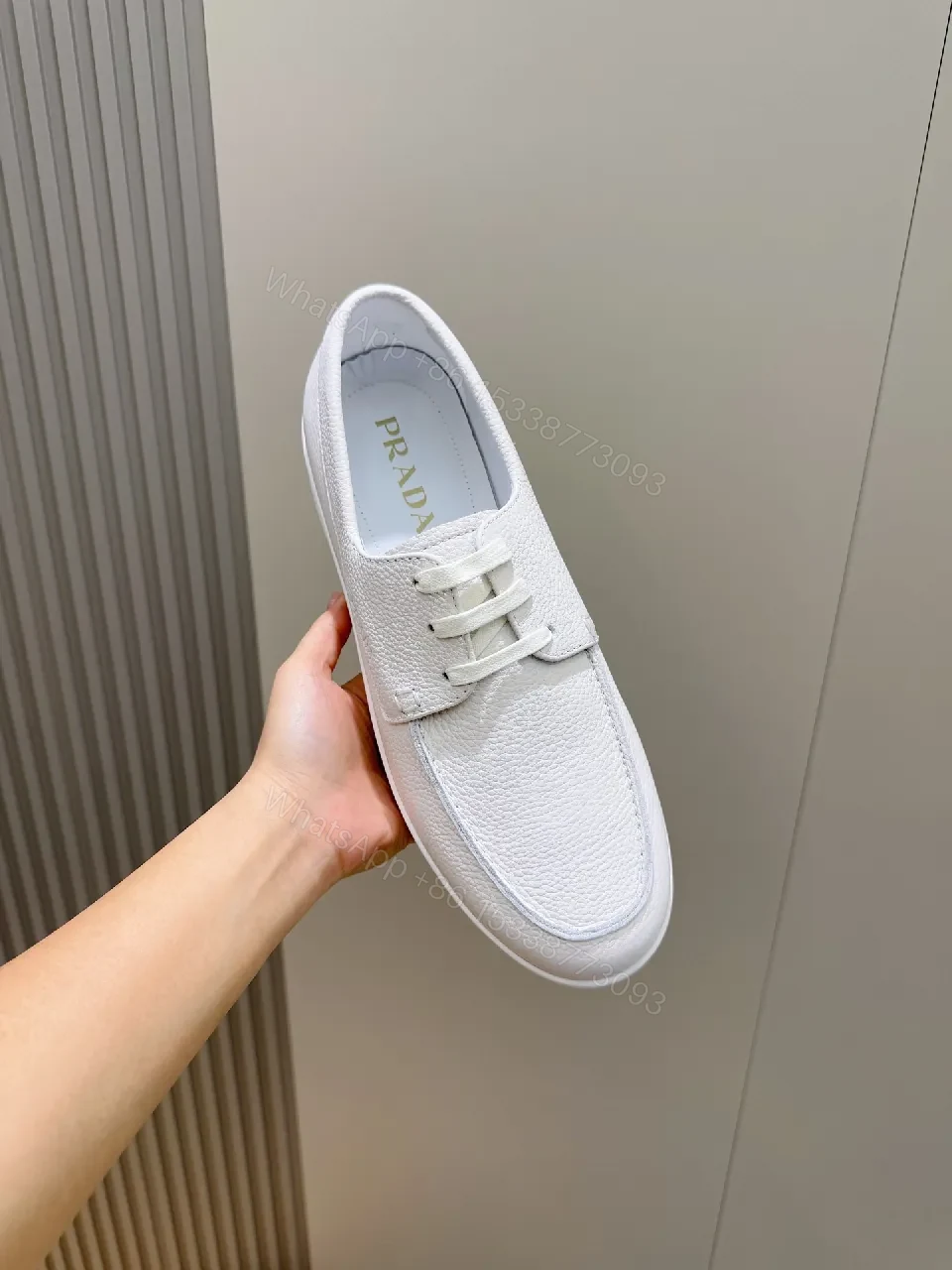 View 7 of Minimalist White Leather Low-Top Sneakers with Subtle Luxury Details