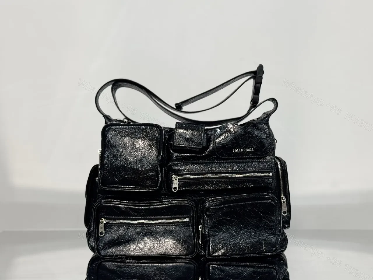 Compact Black Leather Messenger Bag: Sleek Crossbody Utility — view 1