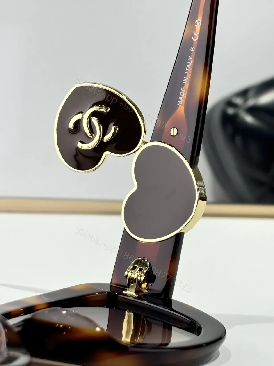 View 2 of Oversized Black Cat-Eye Sunglasses with Subtle Logo Details