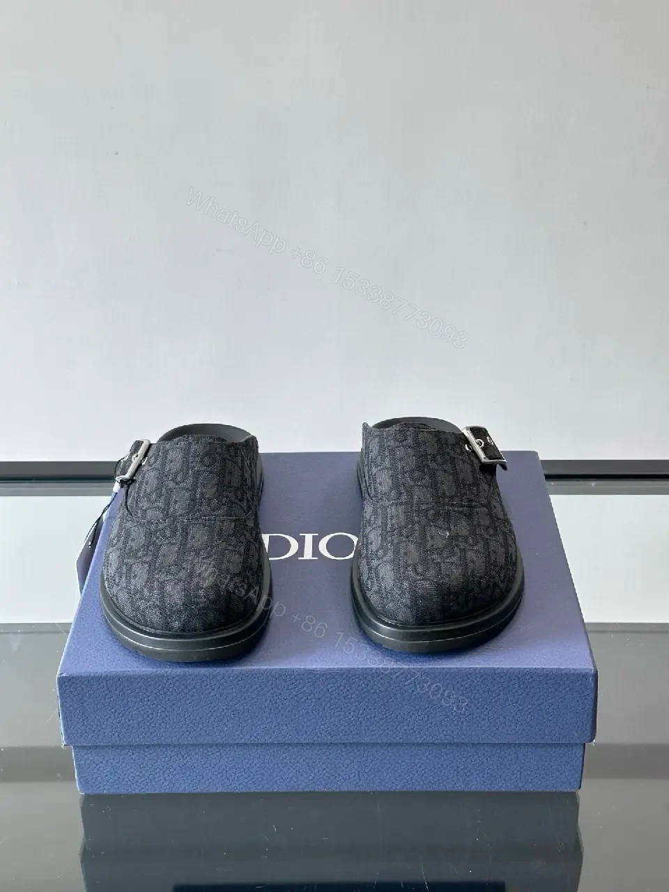 View 4 of Dark Monogram Slip-Ons: Textured Mules with Subtle Buckle