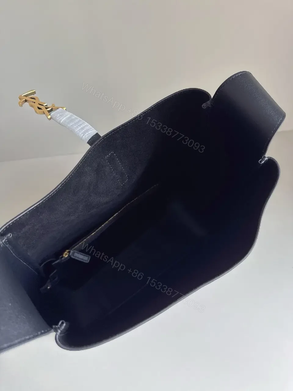 View 9 of Navy Leather Bucket Bag with Gold YSL Charm and Zippered Pocket