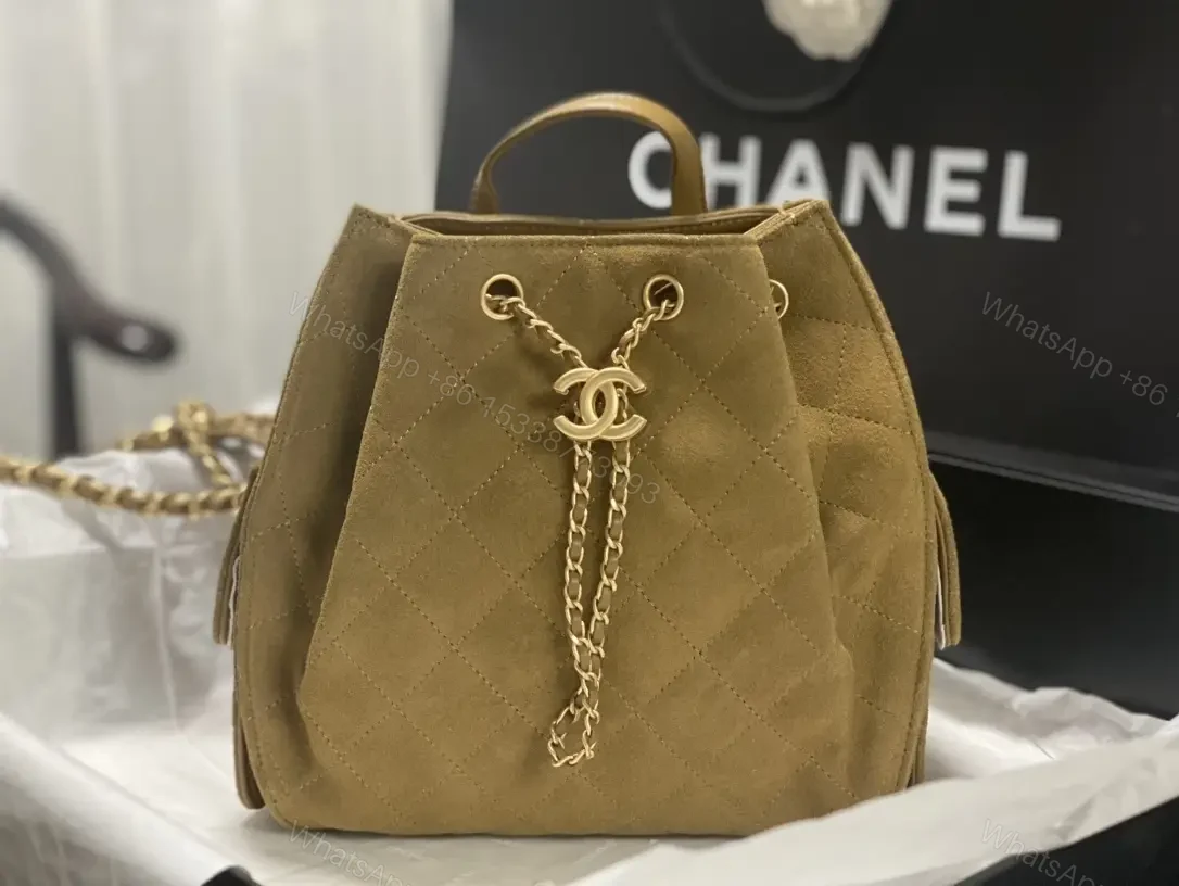 View 5 of Quilted Suede Bucket Bag with Gold Crest Detail