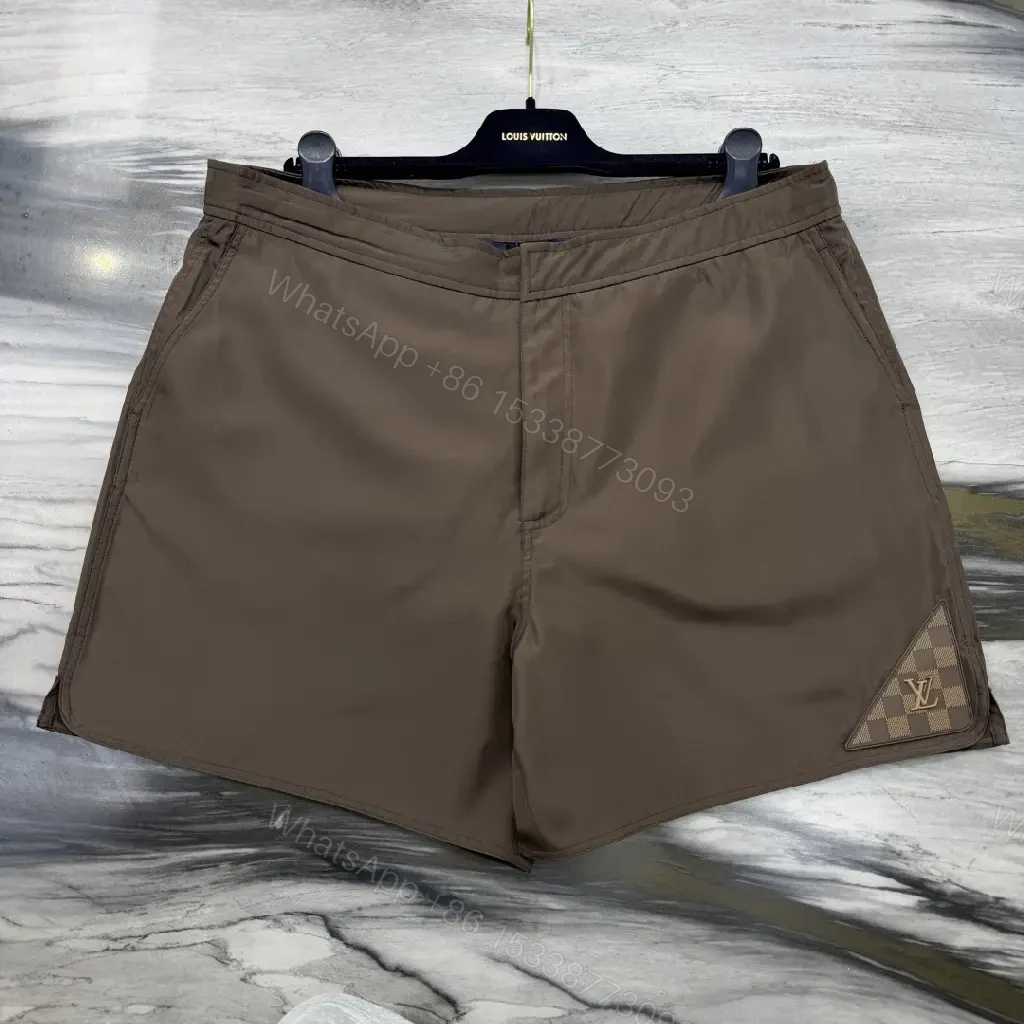 View 9 of Brown Nylon Casual Shorts Louis Vuitton Logo Patch Shorts
