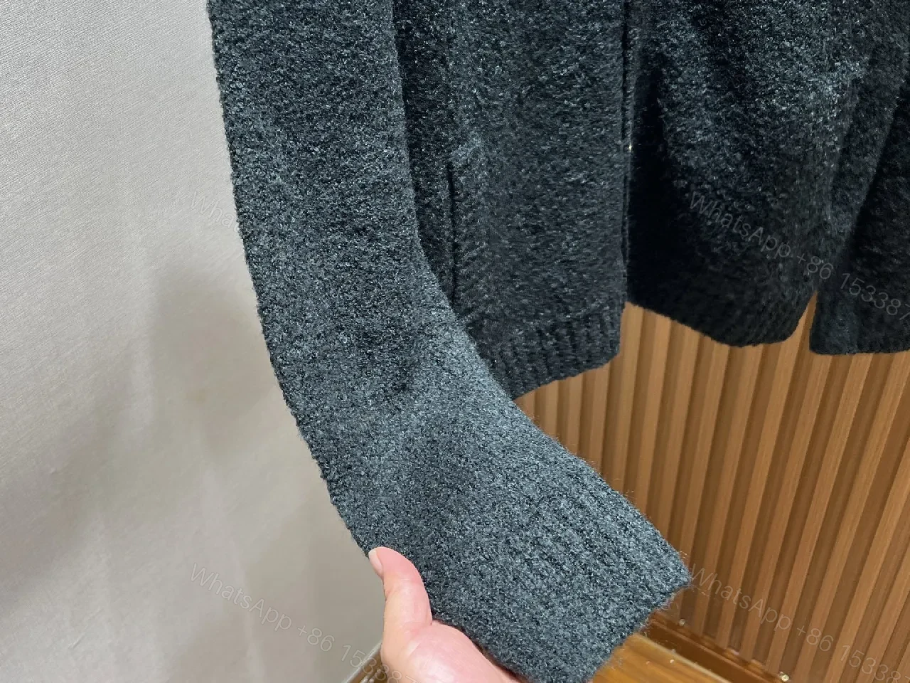 View 10 of Black Boucle Cardigan | Luxe Texture + Signature Logo + Cozy Warmth