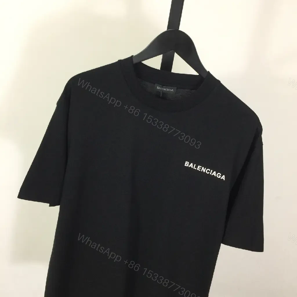 View 4 of Minimalist Black Mockneck Tee: Premium Cotton, Subtle Logo, Versatile Style