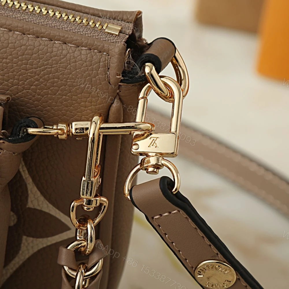 View 7 of Louis Vuitton Multi Pochette Accessoires Monogram Empreinte Greige 25Cm