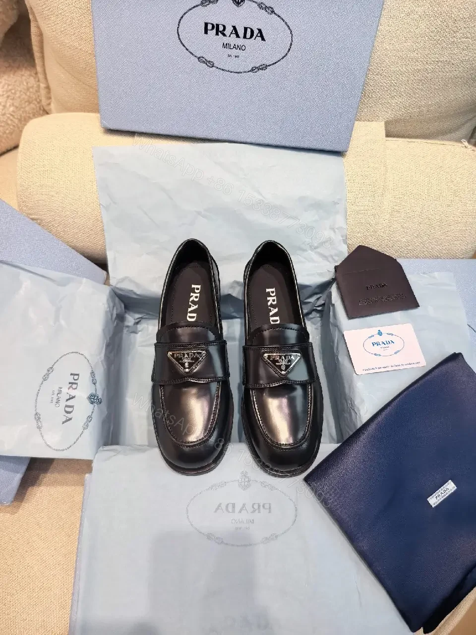 View 2 of Black Leather Prada Slippers with Logo Trim