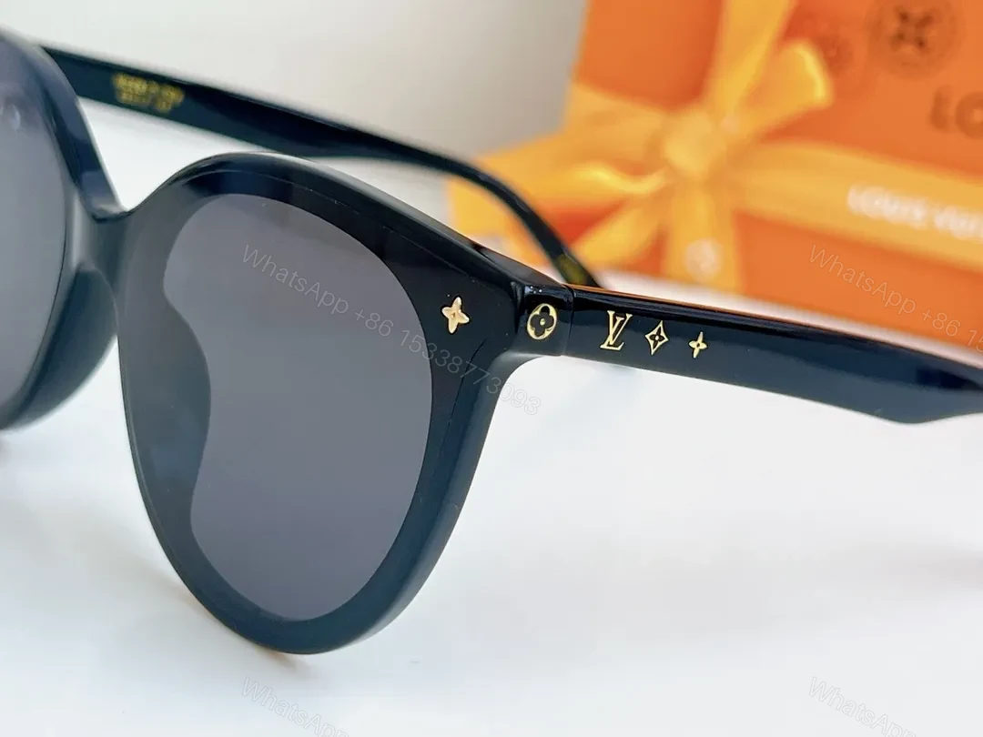 View 9 of Sleek Black Round-Frame Sunglasses with LV Accents