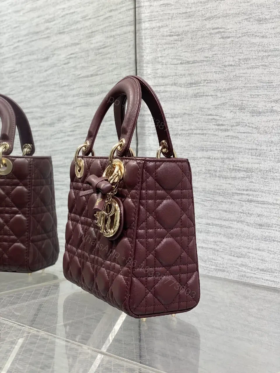 View 6 of Quilted Burgundy Handbag with Top Handles, Structured Charm