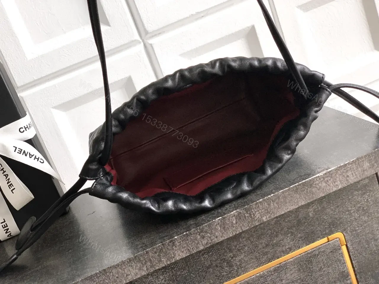 View 9 of Quilted Drawstring Bag - Black Leather-Feel, Gold Accent
